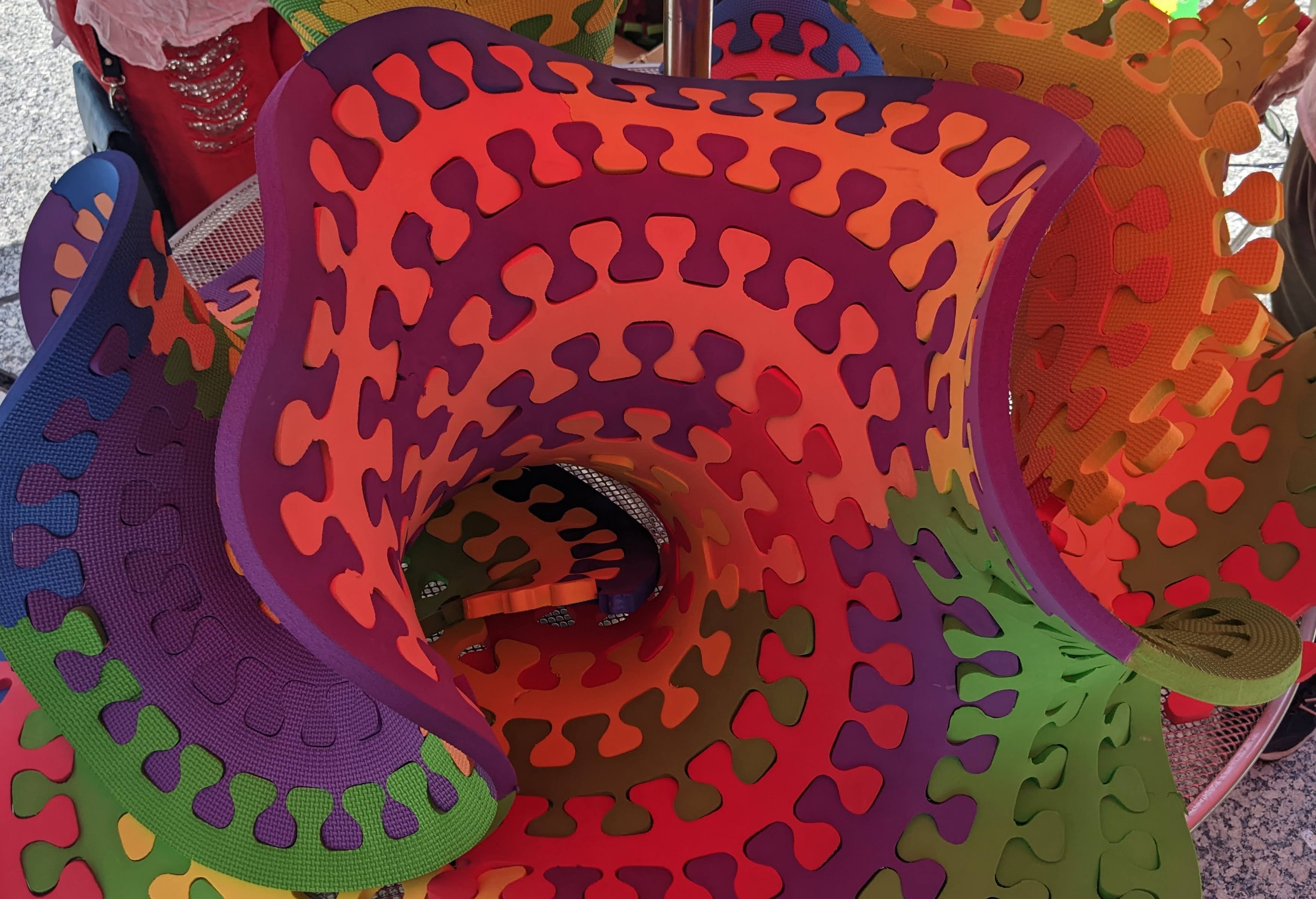 Wooden numbers and mathematical symbols arranged creatively
